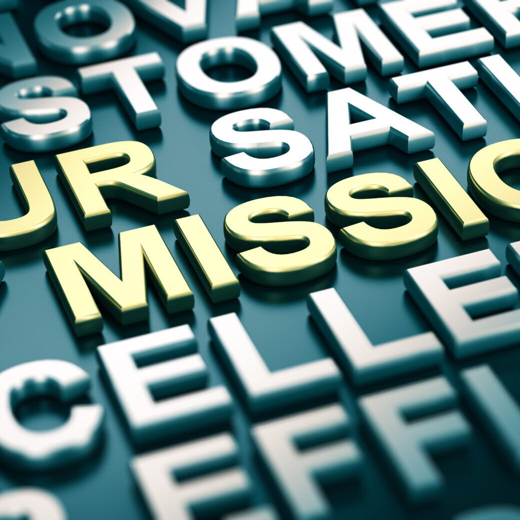 3D illustration of a company mission statement with blur effect and many positive words surrounding the main text